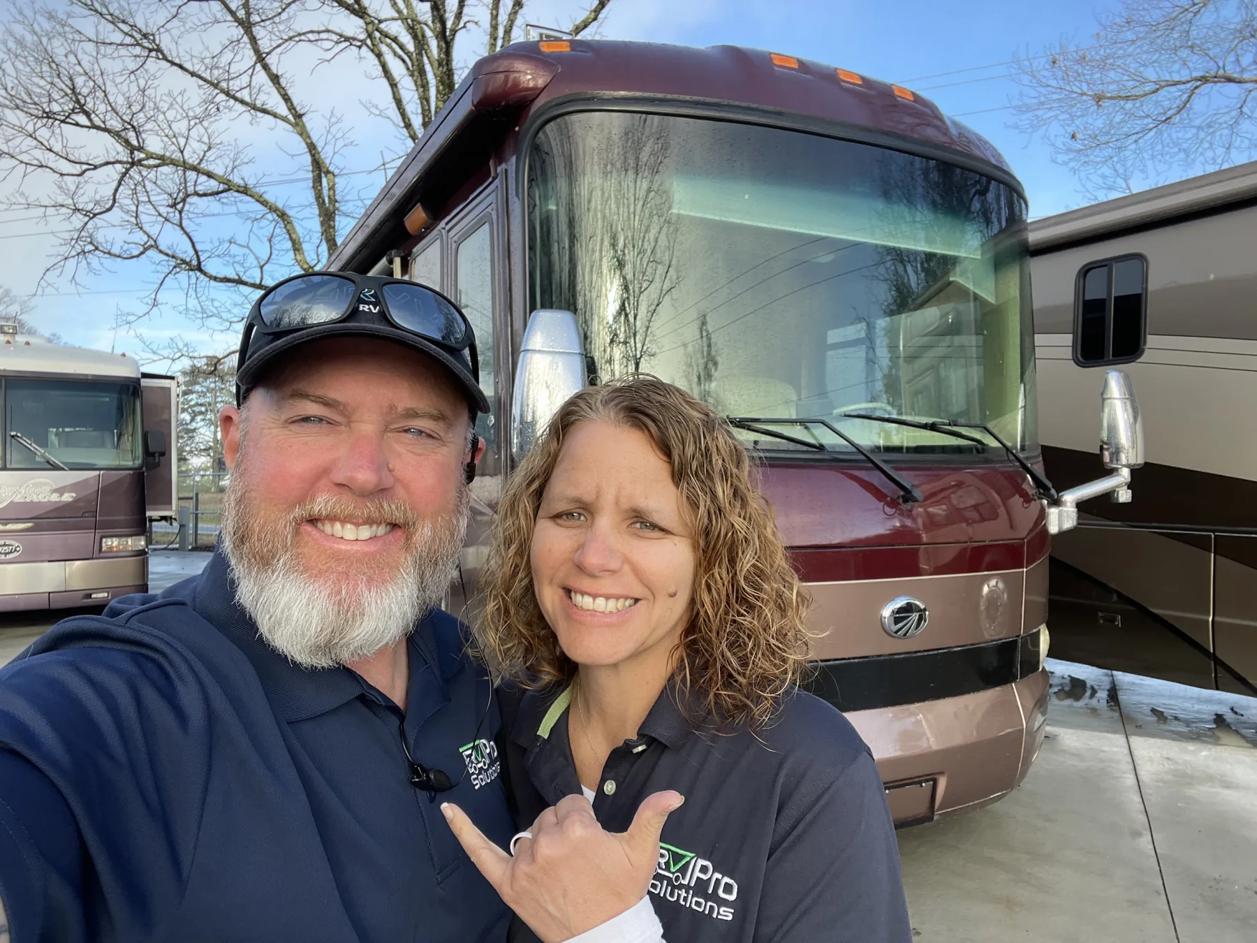 The RV Pro Solutions team beside a motorhome